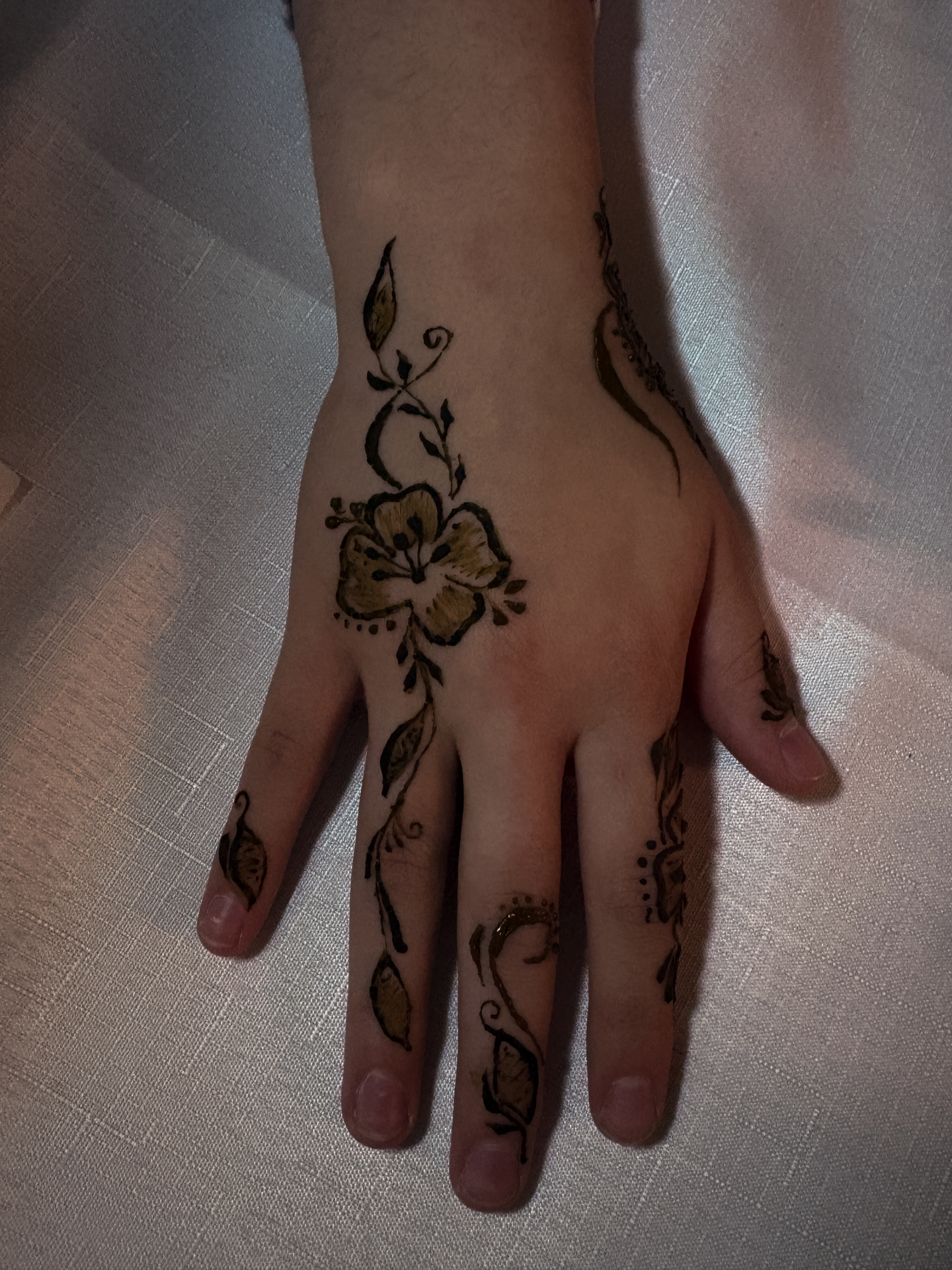 Delicate flower henna hand design